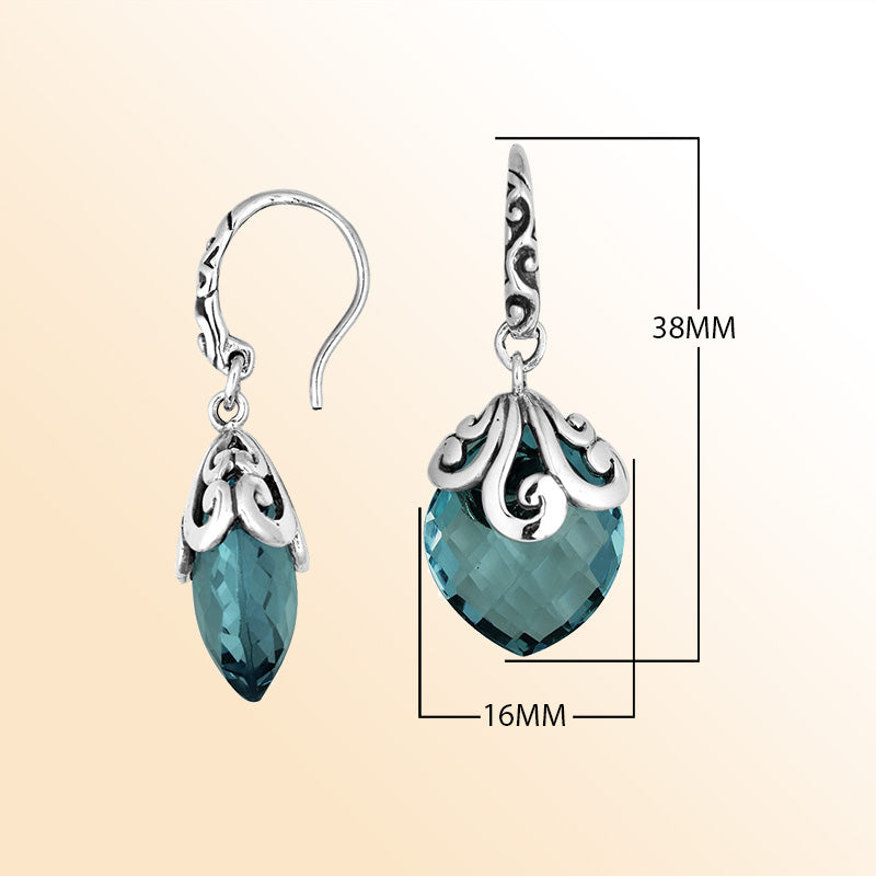 Sterling silver earrings with London Blue Topaz Quartz teardrop design and ornate silver detailing.
