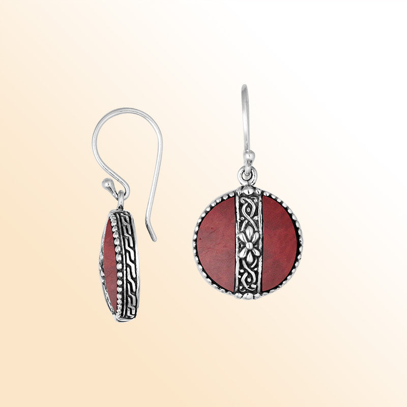 Sterling silver earrings with Red Coral round design and floral silver detailing.