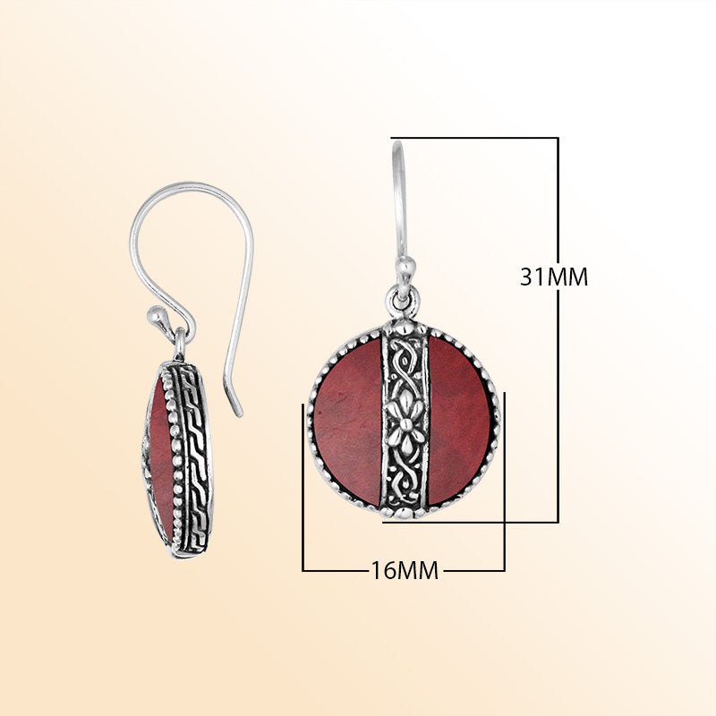 Sterling silver earrings with Red Coral round design and floral silver detailing.