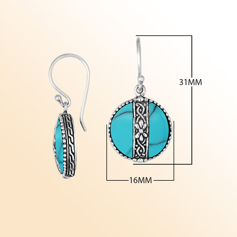 Sterling silver earrings with Turquoise Shell round design and floral silver detailing.