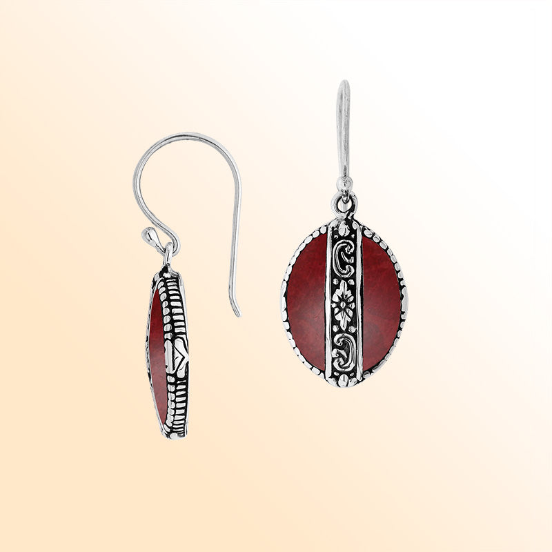 Sterling silver earrings with Red Coral oval design and floral engraved silver detailing.