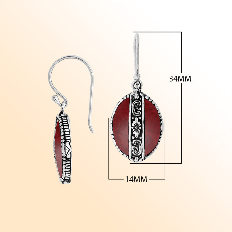 Sterling silver earrings with Red Coral oval design and floral engraved silver detailing.