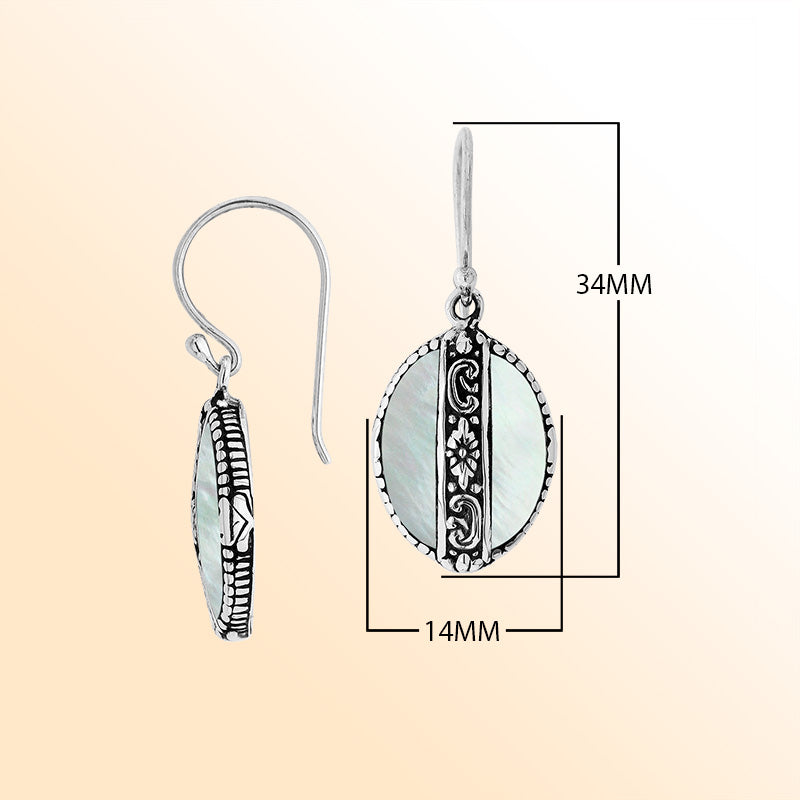Sterling silver earrings with Mother Of Pearl oval design and floral silver detailing.