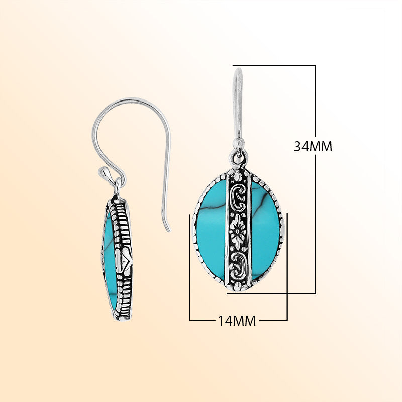 Sterling silver earrings with Turquoise Shell oval design and floral silver detailing.