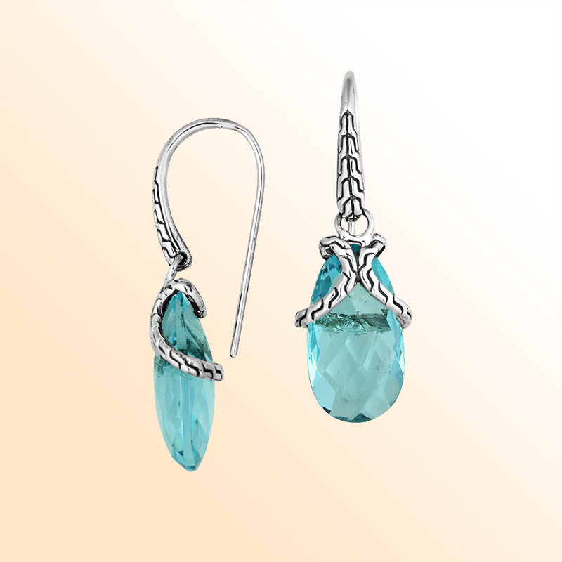 Sterling silver earrings with Blue Topaz Quartz elongated drop design and woven silver detailing.