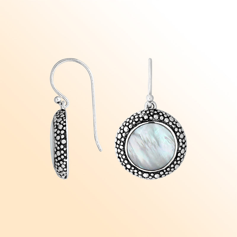 Sterling silver round earrings with Mother Of Pearl and oxidized artisan dotted design.