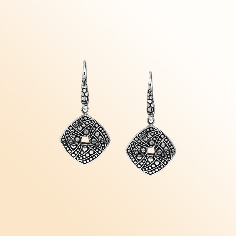 Handcrafted Balinese Sterling Silver Carved Diamond-Shaped Dangle Earrings With Dot And Swirl Pattern Detailing