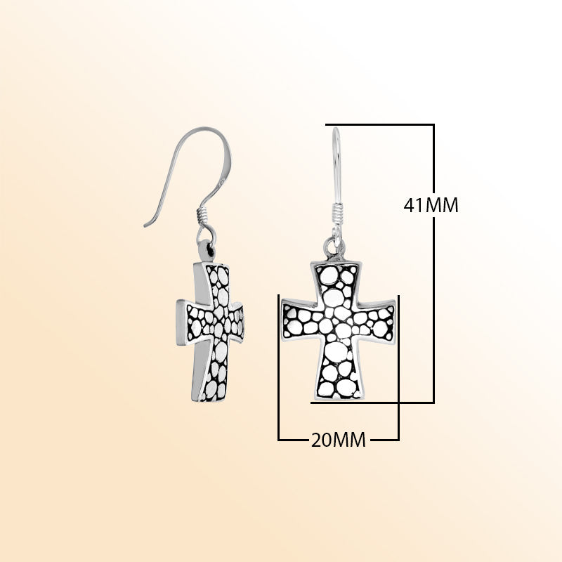 Sterling silver Bali textured cross earrings featuring polished–oxidized detailing and comfortable earwire hooks, created for those who appreciate symbolic, expressive, and handcrafted jewelry designs.