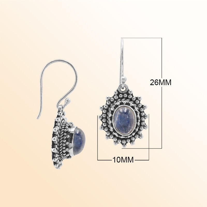 Sterling silver Bali granulated earrings featuring radiant rainbow moonstone cabochons and oxidized beadwork, created for individuals who value expressive, luminous, and artisan-crafted jewelry pieces.