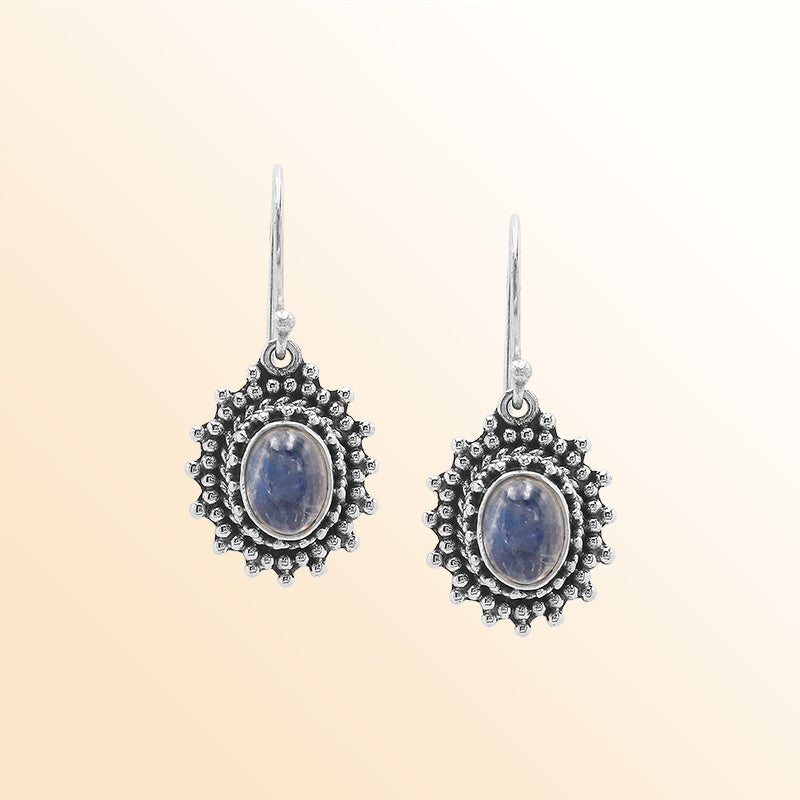 Sterling silver Bali granulated earrings featuring radiant rainbow moonstone cabochons and oxidized beadwork, created for individuals who value expressive, luminous, and artisan-crafted jewelry pieces.
