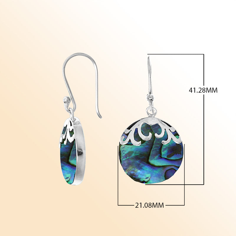 Sterling silver artisan earrings with abalone shell drops and flowing wave-style top.