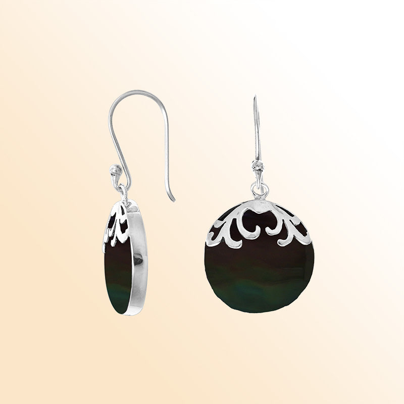 Handcrafted sterling silver earrings with deep-toned Black Shell drops, polished filigree detailing, and comfortable earwire hooks designed for refined accessory styling.