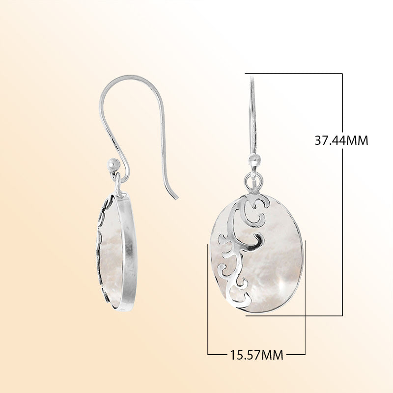 Sterling silver artisan earrings showcasing luminous oval mother of pearl with flowing wave-style overlay, crafted to evoke a serene ocean-inspired look for elegant everyday wear.