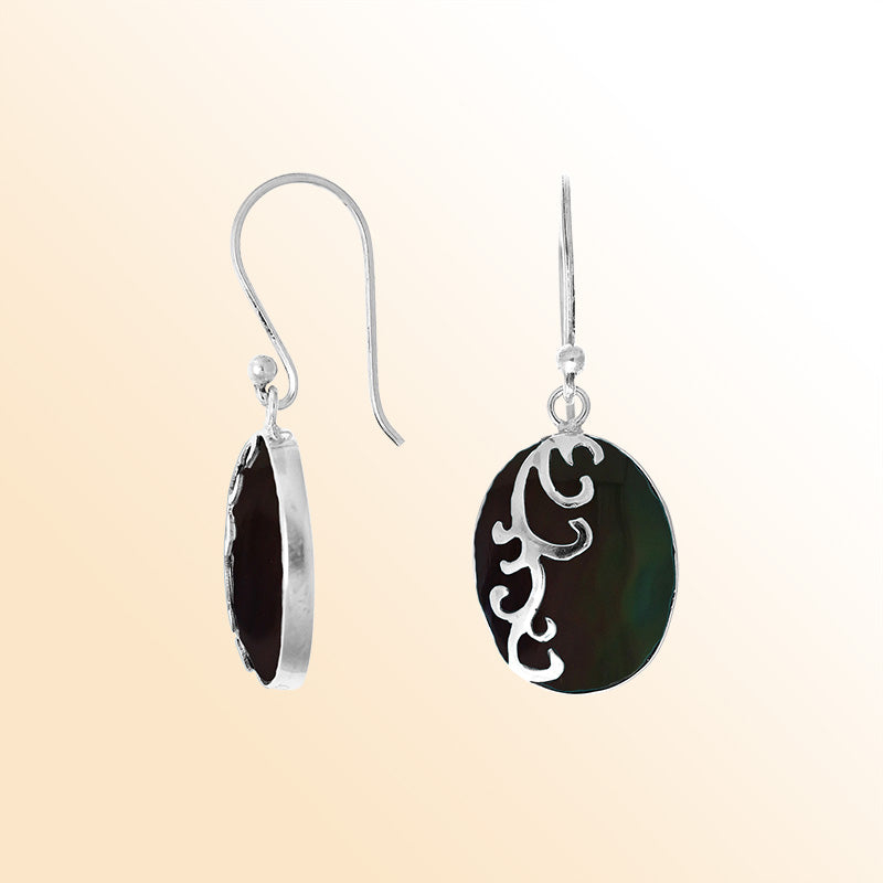 Sterling silver artisan earrings featuring deep-toned oval black shell with a flowing wave-style overlay, crafted to create an expressive, ocean-inspired look for elegant everyday wear.