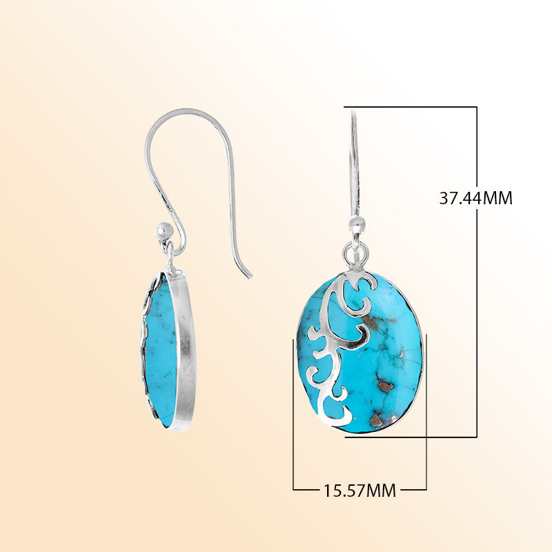 Sterling silver artisan earrings featuring vibrant turquoise shell ovals with a flowing wave-style overlay, designed to create a joyful ocean-inspired look for elegant everyday wear.