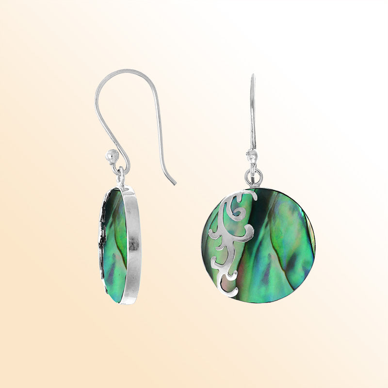 Sterling silver artisan earrings showcasing vibrant round abalone shell with a flowing wave-style overlay, crafted to evoke an expressive ocean-inspired look for elegant everyday wear.