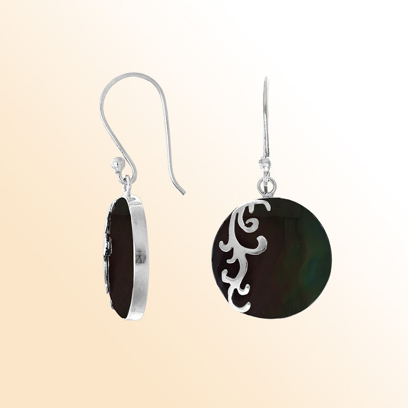 Sterling silver artisan earrings showcasing iridescent round black shell with a flowing wave-style overlay, designed to create an expressive ocean-inspired look for stylish and elegant everyday wear.