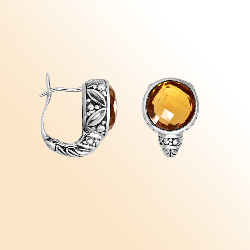 Sterling silver artisan earrings featuring warm faceted citrine quartz framed by ornate Balinese-inspired silverwork, designed to provide expressive elegance and comfortable everyday omega clip wear.