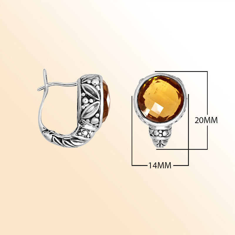 Sterling silver artisan earrings featuring warm faceted citrine quartz framed by ornate Balinese-inspired silverwork, designed to provide expressive elegance and comfortable everyday omega clip wear.