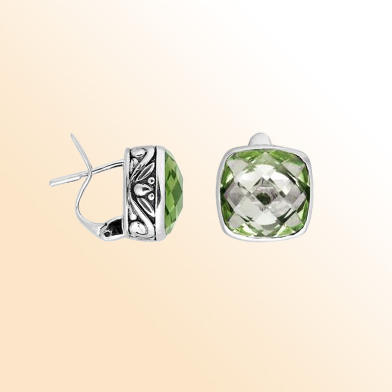 Sterling silver artisan earrings featuring cushion-cut green amethyst quartz with ornate Balinese-inspired metalwork, crafted to offer expressive elegance and comfortable everyday wear with secure omega clip closure.