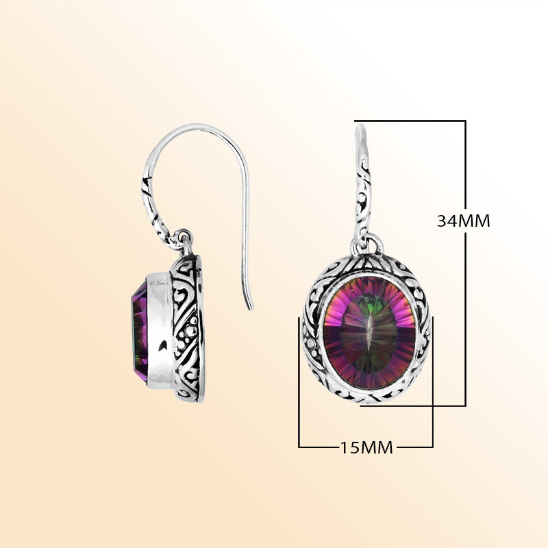 Sterling silver earrings featuring a vibrant oval Mystic Topaz Quartz stone with multicolor brilliance, framed in ornate carved detailing and finished with an earwire lock for radiant handcrafted everyday wear.