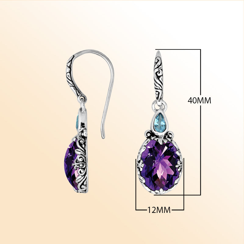 Sterling silver earrings featuring a radiant dual-stone pair of Amethyst Quartz and Blue Topaz Quartz with artistic carved detailing and earwire lock, created for colorful, expressive, handcrafted everyday elegance.