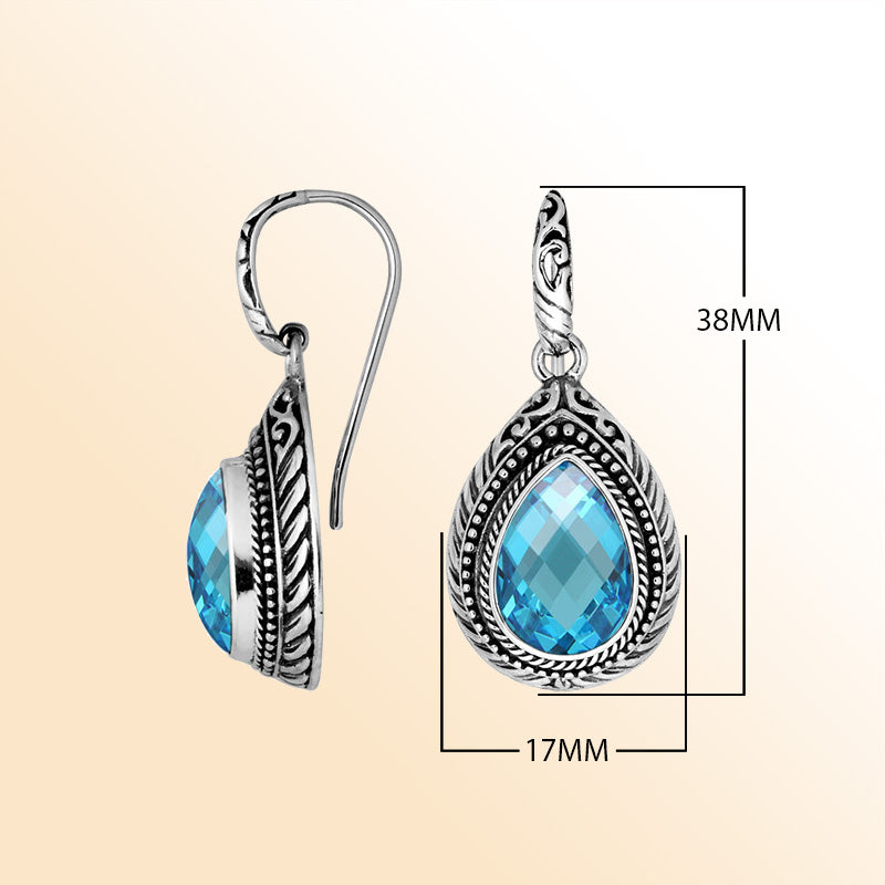 Sterling silver Blue Topaz Quartz teardrop earrings with handcrafted carved silver frame, decorative bead accents, antique-polished finish, and elegant earwire hooks designed for refined everyday and occasion wear.