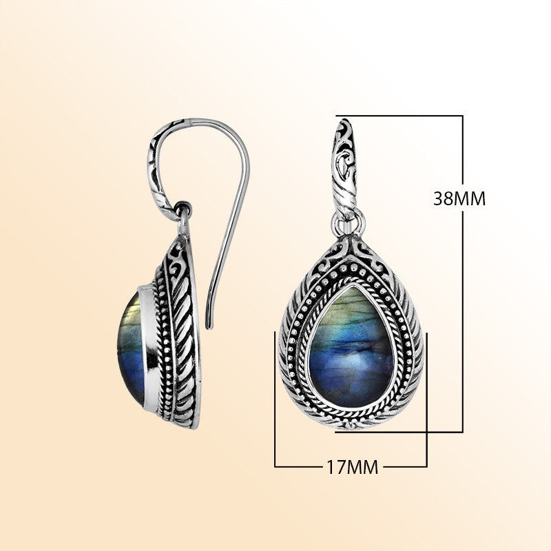 Sterling silver Labradorite teardrop earrings with handcrafted carved silver frame, decorative bead accents, antique-polished finish, and elegant earwire hooks designed for refined everyday and occasion wear.