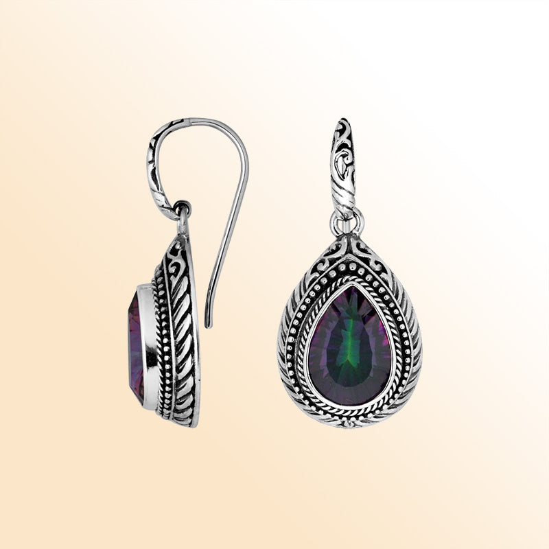 Sterling silver Mystic Quartz teardrop earrings with handcrafted carved silver frame, decorative bead accents, antique-polished finish, and elegant earwire hooks designed for refined everyday and special occasion wear.