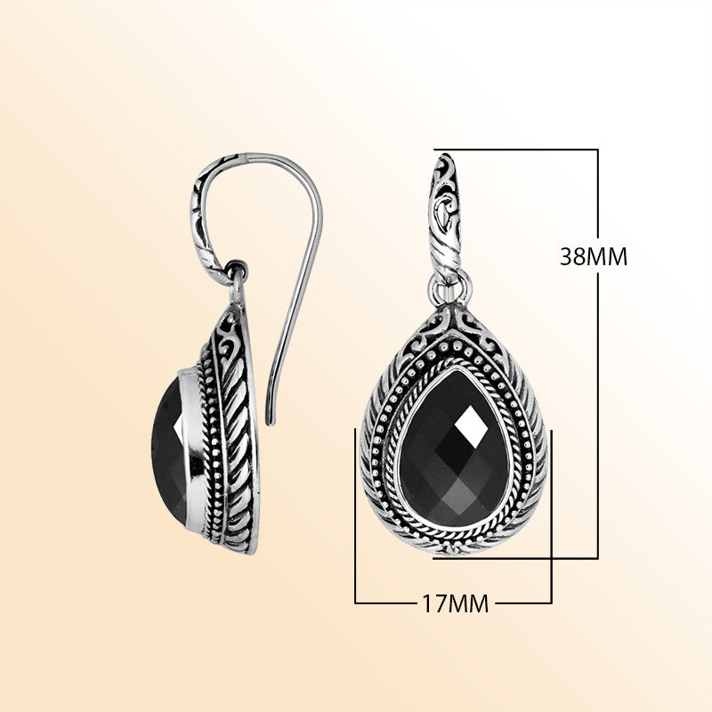 Sterling silver Black Onyx teardrop earrings with handcrafted carved silver frame, decorative bead accents, antique-polished finish, and elegant earwire hooks designed for refined everyday and special occasion wear.