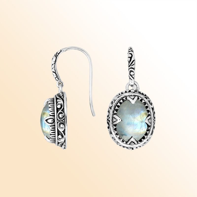 Sterling silver oval earrings with Rainbow Moonstone and intricate oxidized silver craftsmanship.