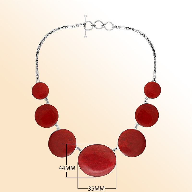 Women’s sterling silver necklace with polished coral discs and Bali-inspired accents.
