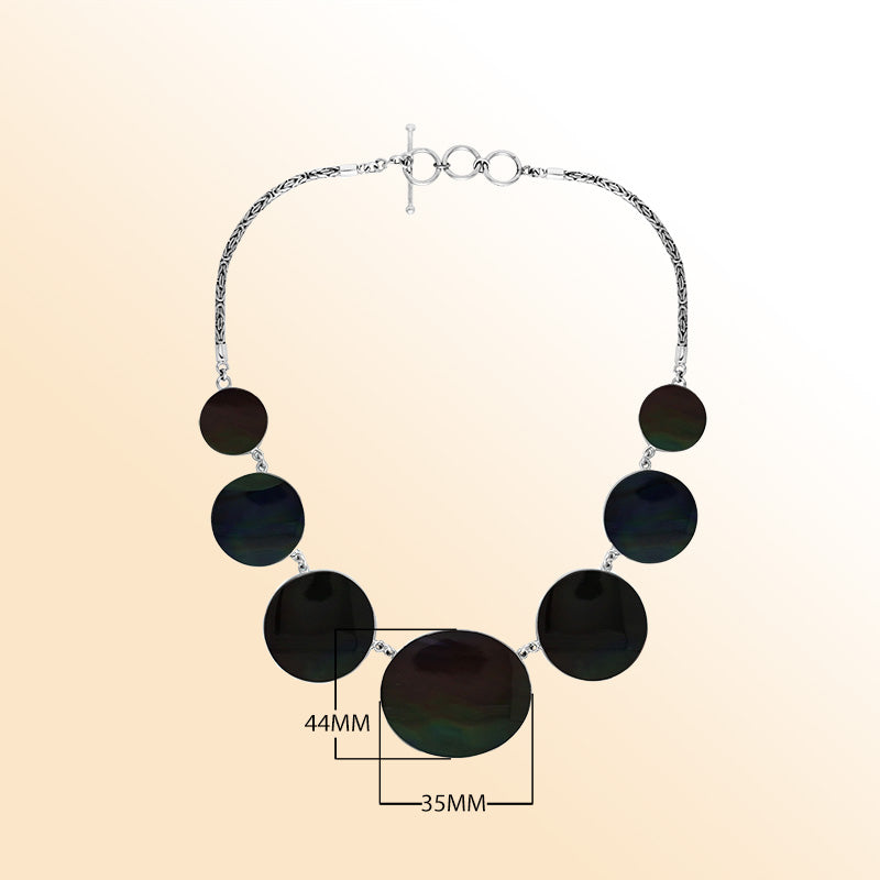 Women’s sterling silver necklace with black shell discs and Bali-inspired accents.