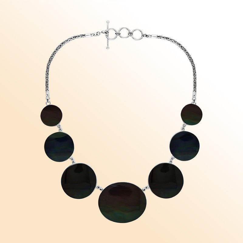 Women’s sterling silver necklace with black shell discs and Bali-inspired accents.