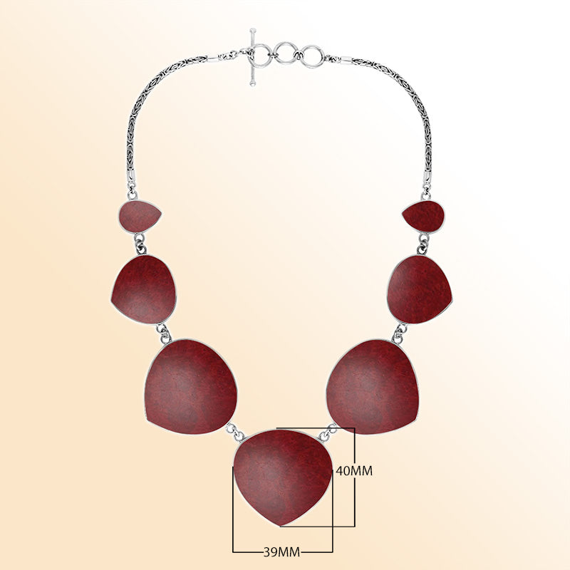 Women’s sterling silver necklace with heart-shape coral stones and Bali-inspired accents.