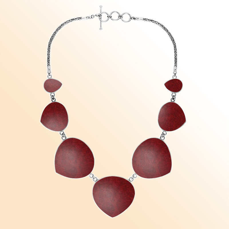 Women’s sterling silver necklace with heart-shape coral stones and Bali-inspired accents.