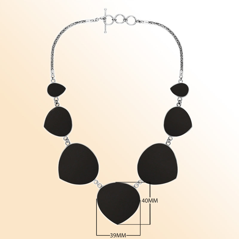 Women’s sterling silver necklace with heart-shape black shell stones and Bali-inspired accents.