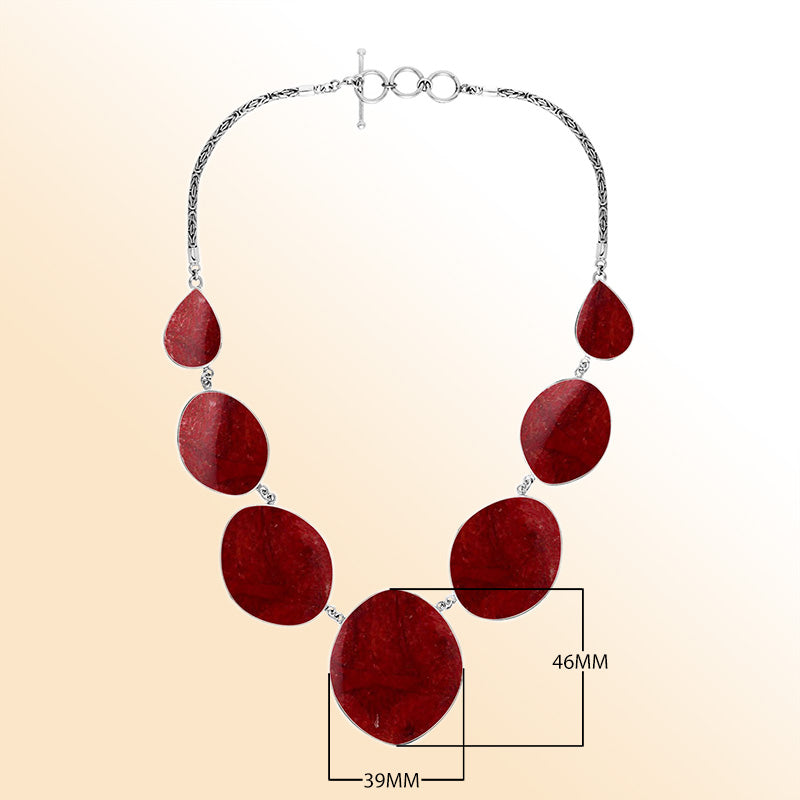 Women’s sterling silver necklace with oval and teardrop coral stones and Bali-inspired accents.
