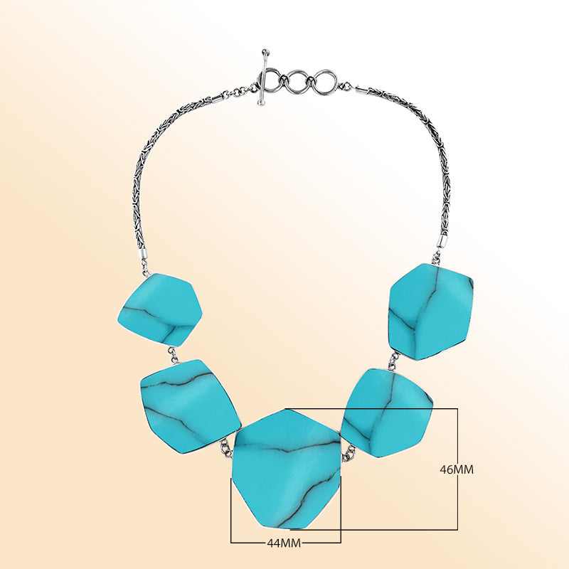 Handcrafted silver necklace with hexagon turquoise shell links in ocean-inspired artisan design.