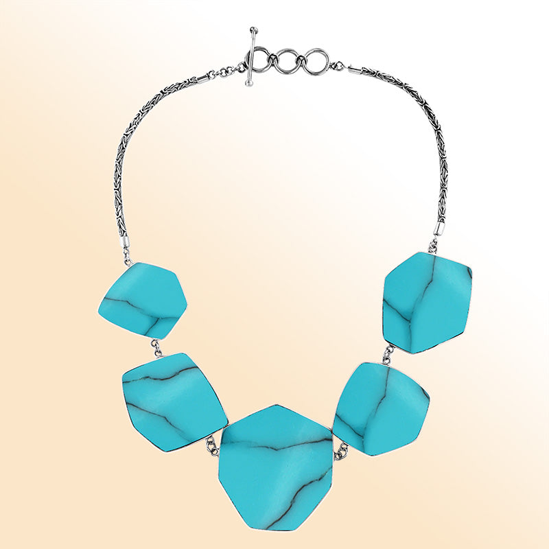 Handcrafted silver necklace with hexagon turquoise shell links in ocean-inspired artisan design.