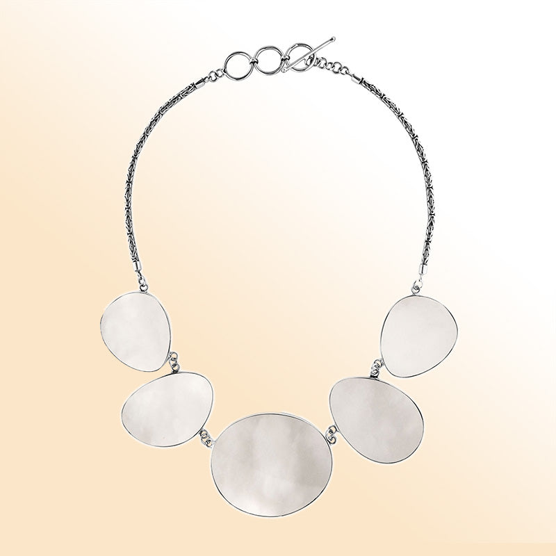 Handcrafted silver necklace with oval Mother of Pearl shell links in elegant artisan design.