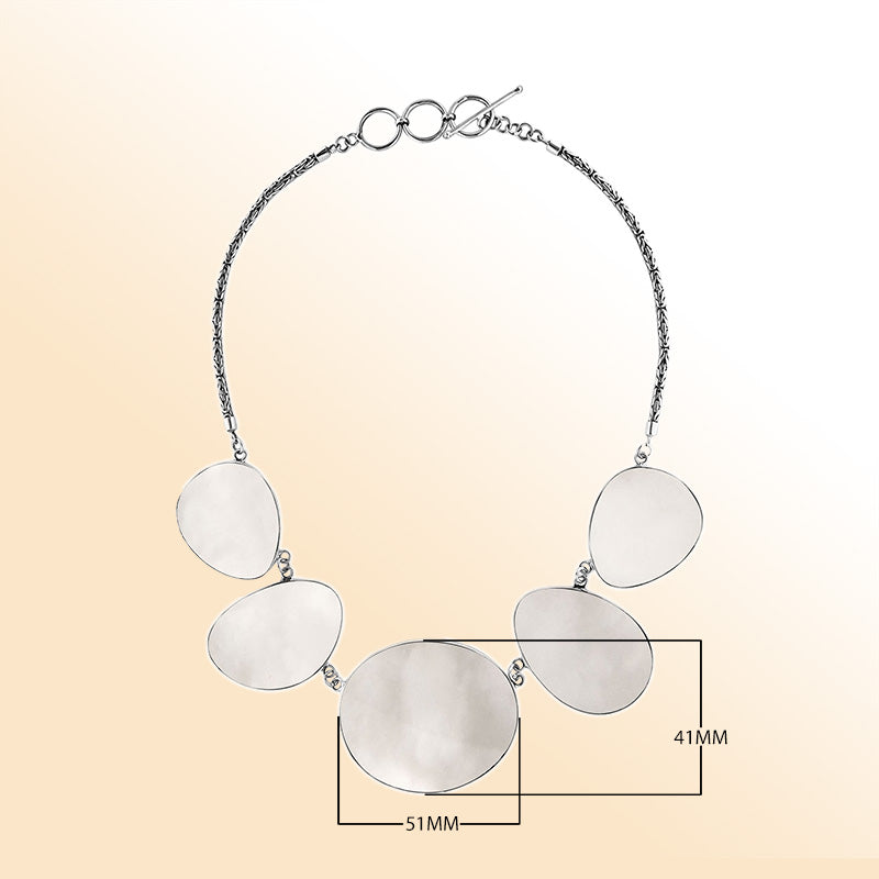 Handcrafted silver necklace with oval Mother of Pearl shell links in elegant artisan design.
