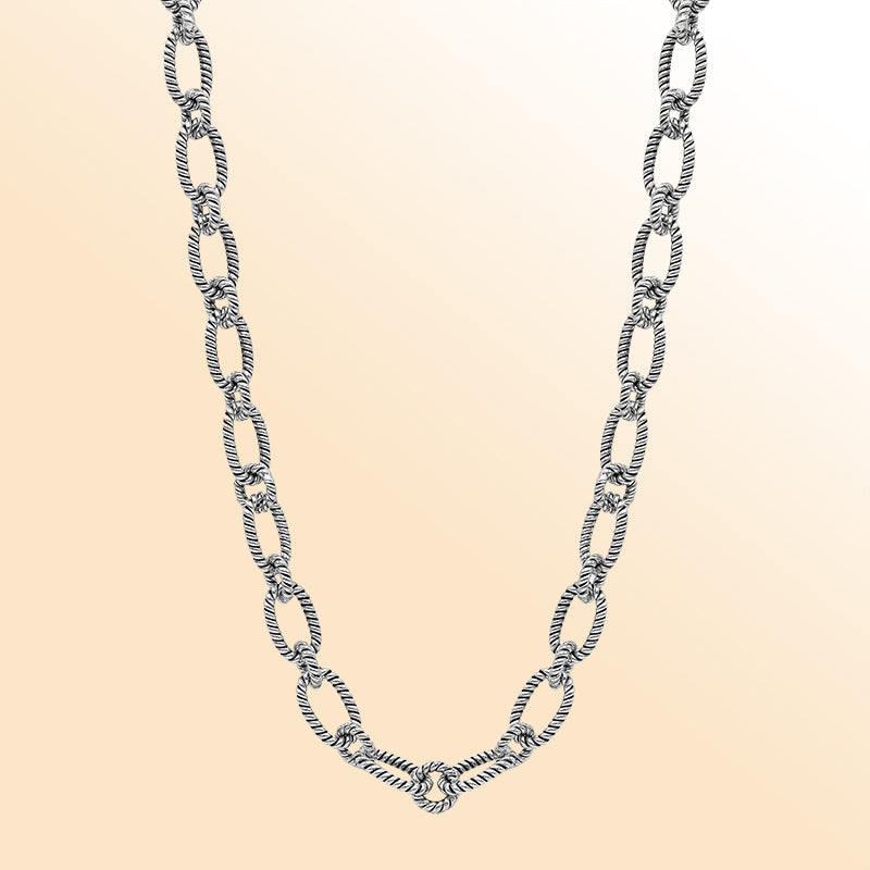 Handcrafted sterling silver rope link chain necklace with toggle clasp.