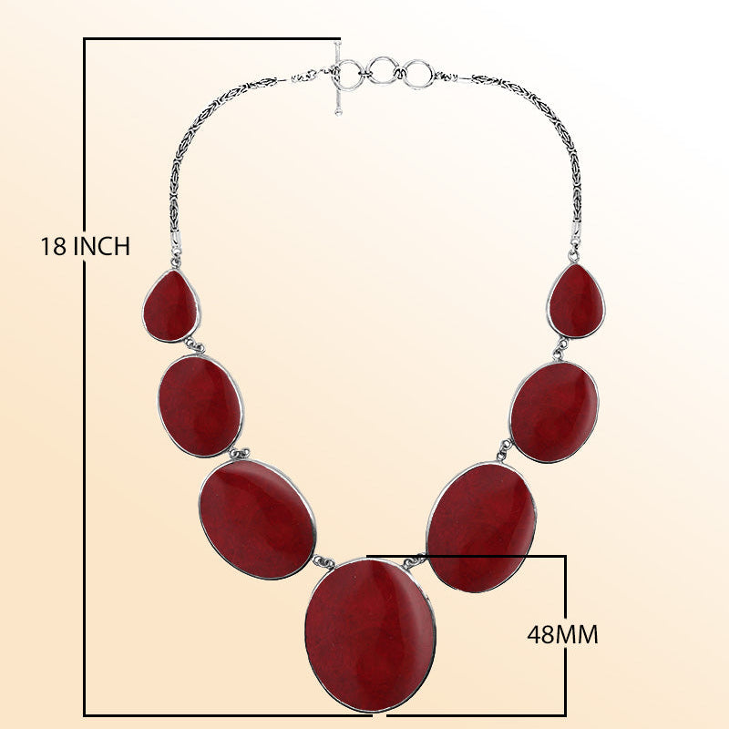 Handmade red coral and sterling silver necklace with oval and teardrop panels, bold artisan jewelry from Bali