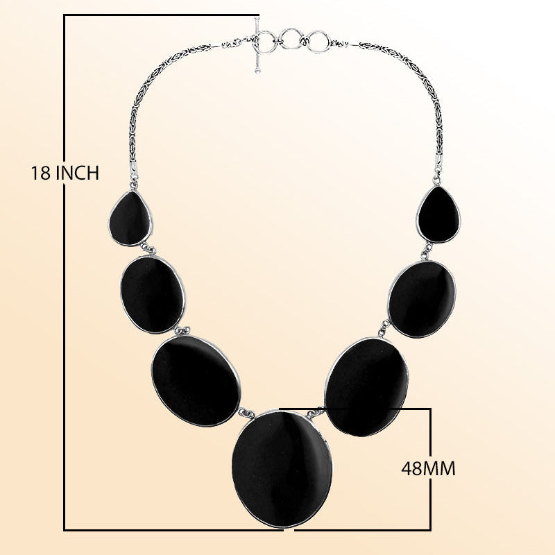 Handmade black shell and sterling silver necklace with oval and teardrop panels, elegant artisan jewelry from Bali