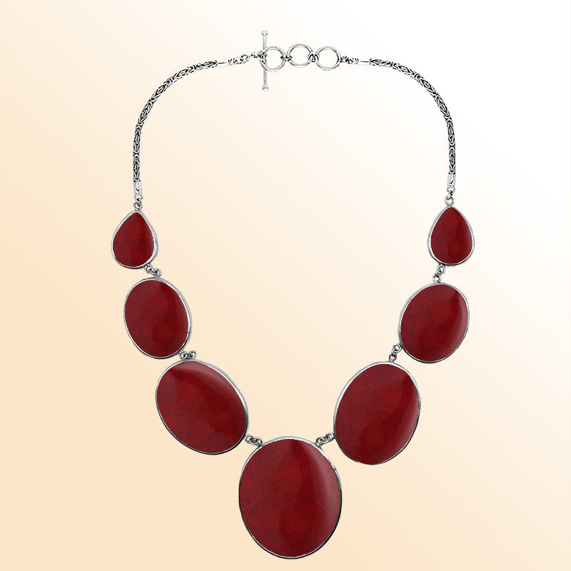 Handmade red coral and sterling silver necklace with oval and teardrop panels, bold artisan jewelry from Bali