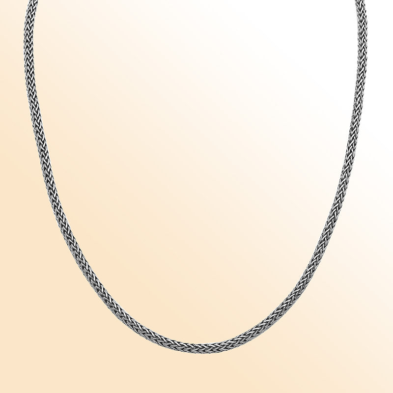 Handmade sterling silver woven chain necklace with blue topaz quartz centerpiece, artisan jewelry from Bali