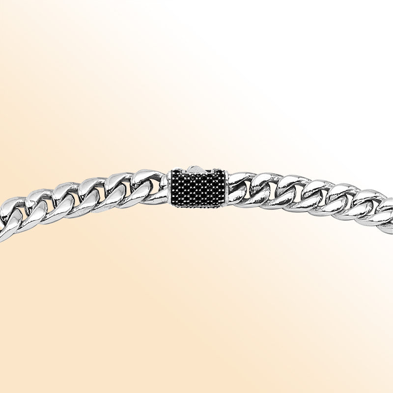 Sterling silver Cuban link chain necklace with black cubic zirconia accent and bold polished links.