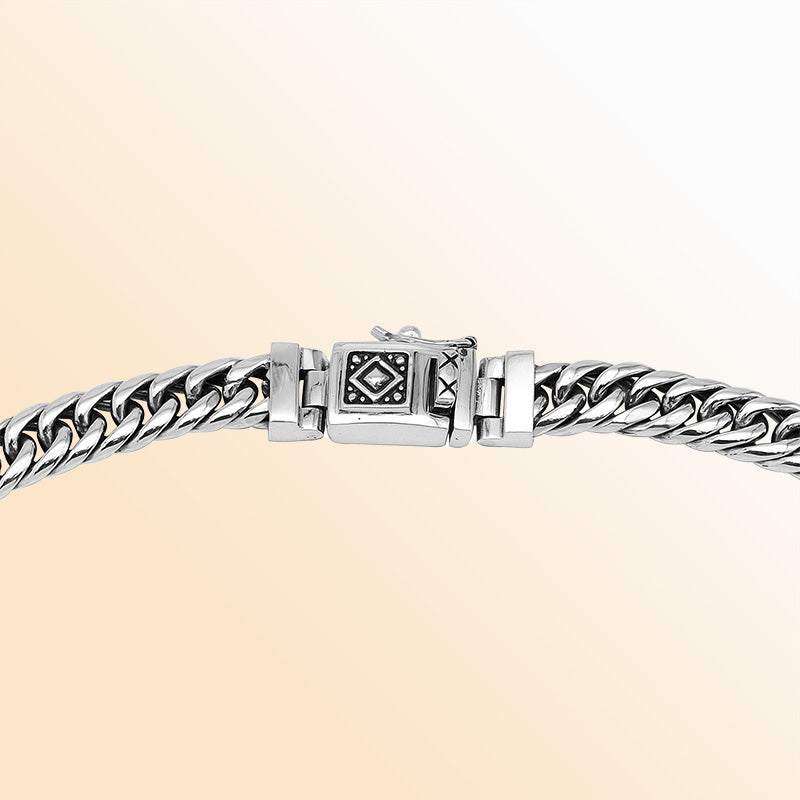 Handcrafted sterling silver woven chain necklace with detailed Balinese clasp, artisan jewelry from Bali.