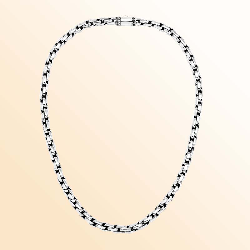 Artisan sterling silver necklace showcasing smooth rounded box links, luminous polished surfaces, subtle oxidized depth, and a refined decorative push clasp.